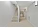 Hallway with carpeted floors, a staircase, and access to other rooms at 109 Aspenridge Dr, Holly Springs, NC 27540