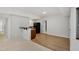 Finished basement kitchenette with wooden floors, bar seating, and black appliances at 109 Aspenridge Dr, Holly Springs, NC 27540