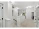Upstairs landing with white walls and railing, carpet, and access to bedrooms at 109 Aspenridge Dr, Holly Springs, NC 27540