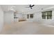 Finished basement space including a living area with a wet bar and carpeted floors at 109 Aspenridge Dr, Holly Springs, NC 27540