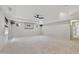 Finished basement area with two windows and carpeted flooring at 109 Aspenridge Dr, Holly Springs, NC 27540