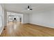 The living room has hardwood floors and is open to the kitchen area at 109 Aspenridge Dr, Holly Springs, NC 27540