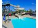A close-up of the community pool's slide that enters the pool with lifeguard station nearby at 109 Aspenridge Dr, Holly Springs, NC 27540