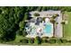 An aerial view of the community pool, featuring water slides, a zero-entry area, and plenty of seating at 109 Aspenridge Dr, Holly Springs, NC 27540