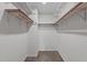 Walk-in closet with carpet flooring and multiple levels of shelving at 11 Stone Village Ct, Durham, NC 27704