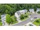 Aerial view of the home in a residential neighborhood with tree-lined streets at 110 Knightwood Dr, Durham, NC 27703