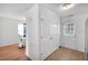 Bright dining area with a door to the backyard and a view to the dining room at 110 Knightwood Dr, Durham, NC 27703