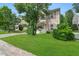 Inviting two-story home features a lush lawn, neat landscaping, and a cozy facade at 110 Knightwood Dr, Durham, NC 27703