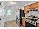 Well-equipped kitchen with stainless steel appliances and backyard access at 110 Knightwood Dr, Durham, NC 27703