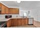 Open kitchen with stainless steel appliances, ample cabinets, and a tile floor at 110 Knightwood Dr, Durham, NC 27703