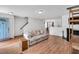 Bright living room boasts natural light, hardwood floors, and a cozy fireplace at 110 Knightwood Dr, Durham, NC 27703