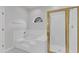 Elegant bathroom featuring a glass shower, a tub, and a window for natural light at 1202 Kendall Dr, Durham, NC 27703