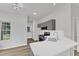 Stylish kitchen with gray cabinets, quartz countertops, stainless steel appliances, and ample natural light at 1202 Kendall Dr, Durham, NC 27703