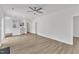 Open-concept living room showcasing wood floors and abundant natural light at 1202 Kendall Dr, Durham, NC 27703