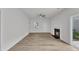 Spacious living room featuring wood floors and a fireplace at 1202 Kendall Dr, Durham, NC 27703