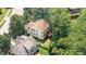 Aerial view of the property showing its layout, including the backyard deck, and surrounding greenery at 1304 Barnford Mill Rd, Wake Forest, NC 27587