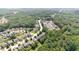 Community aerial view highlighting numerous homes and mature trees in a neighborhood setting at 1304 Barnford Mill Rd, Wake Forest, NC 27587
