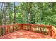 Spacious deck area with painted railing, providing a great view of the surrounding greenery at 1304 Barnford Mill Rd, Wake Forest, NC 27587