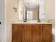 Bathroom features a double vanity with granite countertop, dark wood cabinetry at 1304 Barnford Mill Rd, Wake Forest, NC 27587