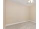 A beige carpeted bedroom with a neutral-toned walls and a ceiling fan at 1304 Barnford Mill Rd, Wake Forest, NC 27587