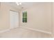 Bright bedroom features neutral walls, a window with natural light, and closet at 1304 Barnford Mill Rd, Wake Forest, NC 27587