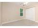 Carpeted bedroom with natural light, a window with tree views, and a double door closet at 1304 Barnford Mill Rd, Wake Forest, NC 27587