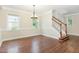 Inviting dining area featuring hardwood floors, natural light, and staircase access to upper levels at 1304 Barnford Mill Rd, Wake Forest, NC 27587