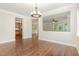 Elegant dining room with hardwood flooring and decorative lighting, perfect for entertaining guests at 1304 Barnford Mill Rd, Wake Forest, NC 27587