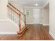 Welcoming entryway features hardwood floors, staircase and ample natural light from the adjacent windows at 1304 Barnford Mill Rd, Wake Forest, NC 27587