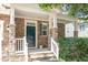 Charming front porch with stone accents and manicured landscaping offering inviting curb appeal at 1304 Barnford Mill Rd, Wake Forest, NC 27587