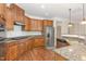 Spacious kitchen with stainless steel appliances and granite countertops, ideal for cooking enthusiasts at 1304 Barnford Mill Rd, Wake Forest, NC 27587