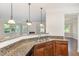 Kitchen area featuring granite countertops, stainless steel appliances, and a view to the living area at 1304 Barnford Mill Rd, Wake Forest, NC 27587