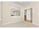 Bright, neutral living area featuring soft carpet and an open view to the cozy living room at 1304 Barnford Mill Rd, Wake Forest, NC 27587