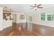 Open-concept living room boasts hardwood floors, kitchen bar and access to a private deck at 1304 Barnford Mill Rd, Wake Forest, NC 27587