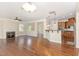 Open-concept living area showcases a fireplace, kitchen bar, and modern lighting fixtures at 1304 Barnford Mill Rd, Wake Forest, NC 27587