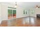 Bright living room features hardwood floors, fireplace, and access to a private outdoor deck at 1304 Barnford Mill Rd, Wake Forest, NC 27587