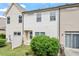 A townhouse backyard featuring a small yard, patio, and sliding glass door at 140 Token House Rd, Durham, NC 27703