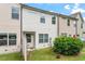 Exterior back view of a two-story home with a small yard and partial fencing at 140 Token House Rd, Durham, NC 27703