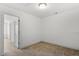 Bedroom showcasing neutral walls and carpet with two doorways and a clean and spacious design at 140 Token House Rd, Durham, NC 27703