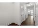Bright hallway with hardwood flooring and access to living areas, offering seamless transition at 140 Token House Rd, Durham, NC 27703