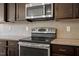 Gourmet kitchen with stainless steel appliances and granite countertops at 140 Token House Rd, Durham, NC 27703