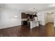 Open kitchen with dark cabinetry, stainless appliances, and a granite island at 140 Token House Rd, Durham, NC 27703