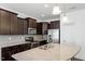 Well-equipped kitchen with granite countertops, stainless steel appliances, and dark cabinets at 140 Token House Rd, Durham, NC 27703