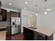 Modern kitchen with stainless steel appliances, a granite island, and plenty of cabinet space at 140 Token House Rd, Durham, NC 27703