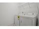 Laundry room featuring a washer and dryer with overhead wire shelving at 140 Token House Rd, Durham, NC 27703