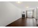 Open living room with hardwood flooring, a fireplace, and lots of natural light at 140 Token House Rd, Durham, NC 27703