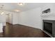 Spacious living room features a fireplace with sleek hardwood floors throughout at 140 Token House Rd, Durham, NC 27703