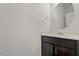 Powder room featuring modern vanity and round mirror at 140 Token House Rd, Durham, NC 27703