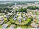 Aerial view of a residential area with mature trees and diverse housing styles at 1400 Manley Ct, Fuquay Varina, NC 27526