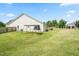 Spacious backyard with a swing set and a pergola covered patio, perfect for outdoor relaxation and play at 1400 Manley Ct, Fuquay Varina, NC 27526